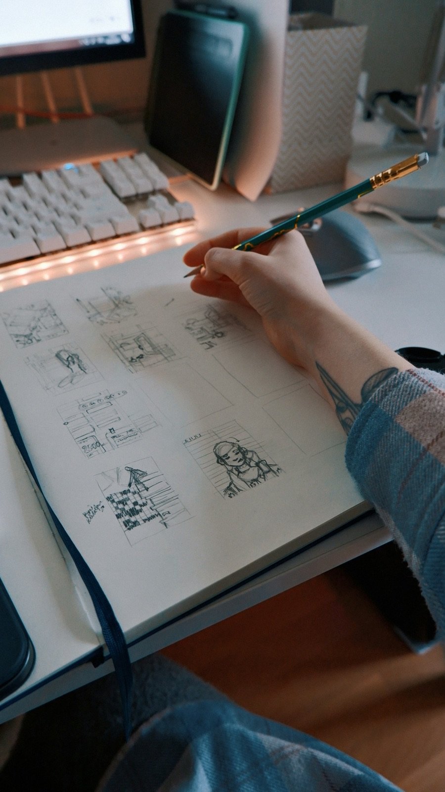 Designer sketching app screens on paper